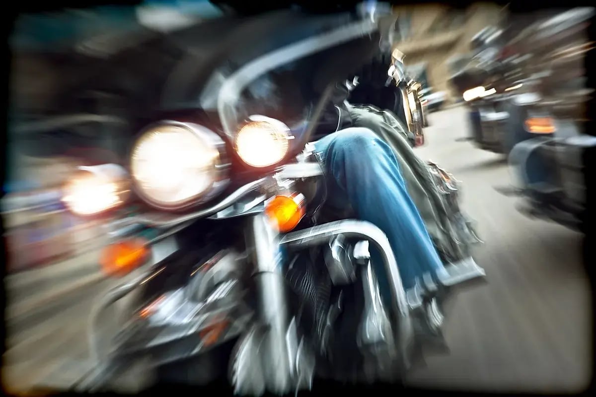 A speeding motorcycle.