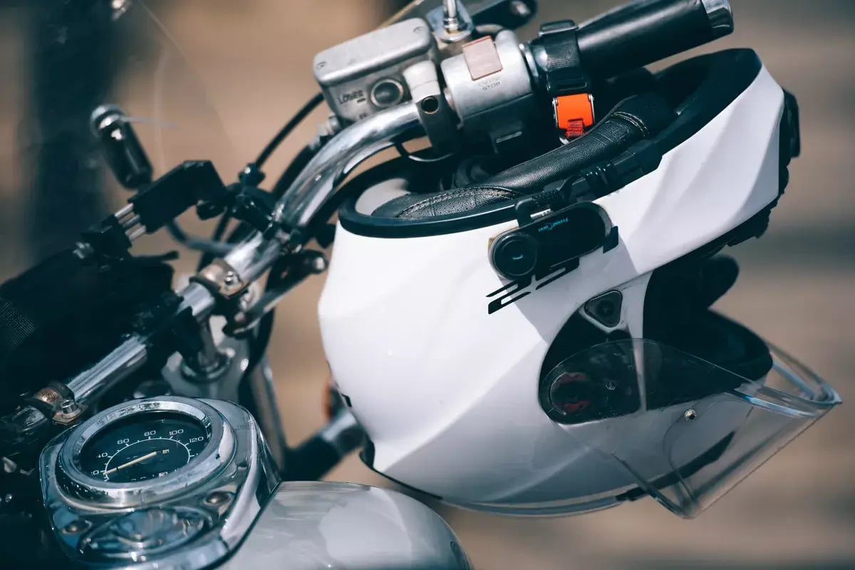 Motorcycle helmet, motorcyclist's helmet hangs on a motorcycle