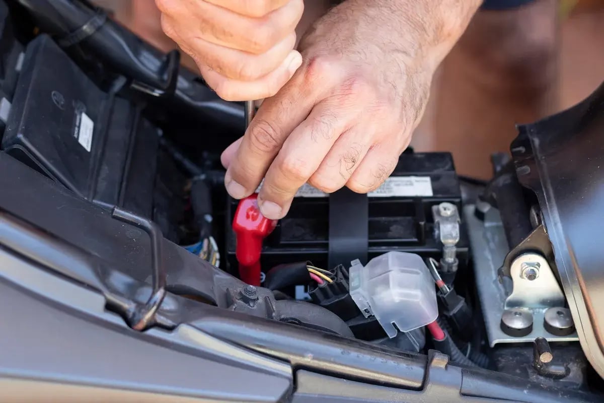 Servicing a motorcycle, changing the battery