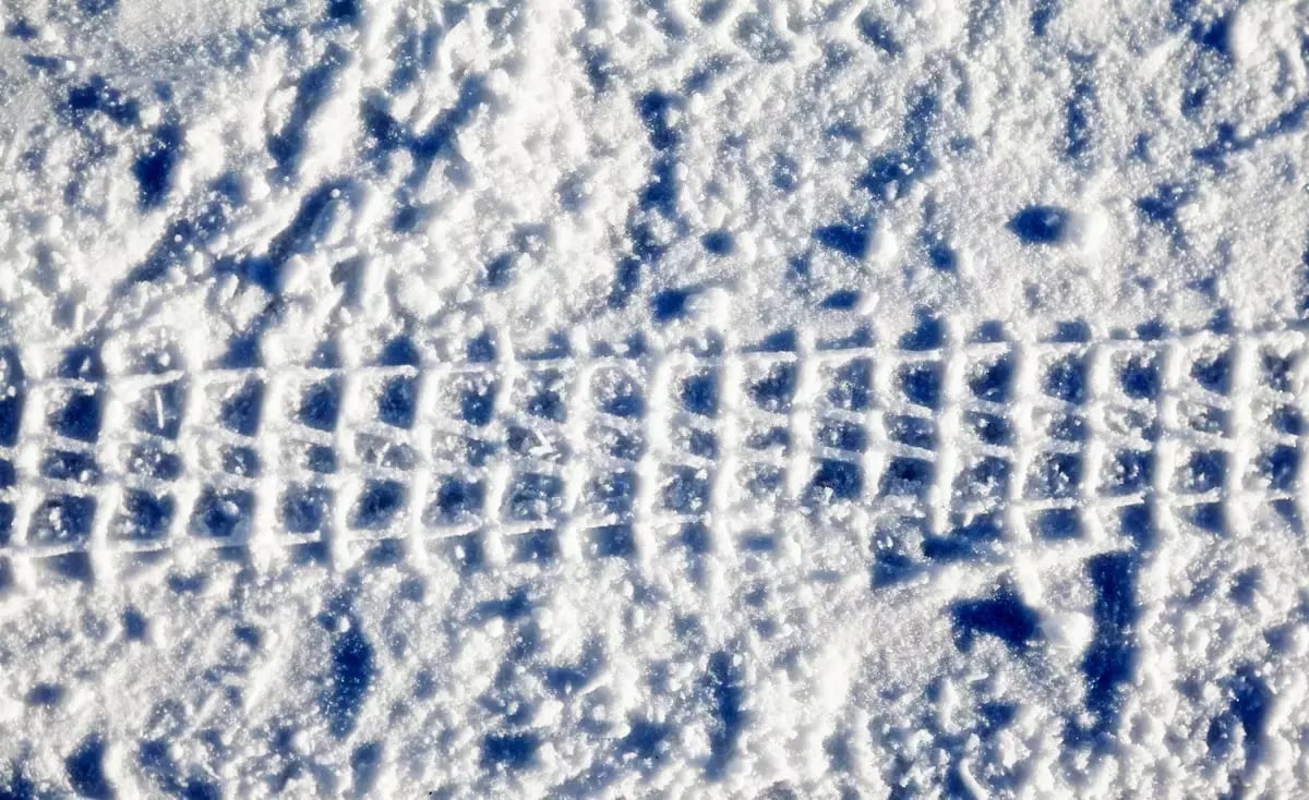 motorcycle tracks in the fresh snow